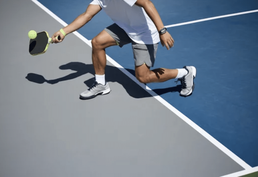 man playing pickleball on court